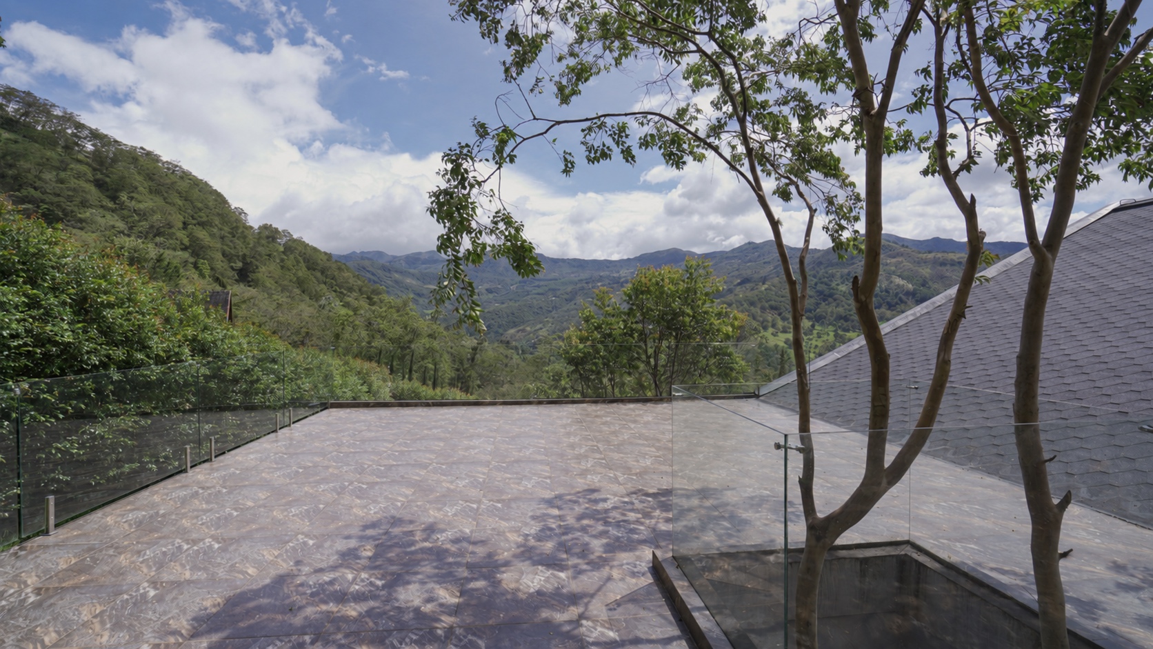 Casa Colina’s tree terrace and mountain landscape